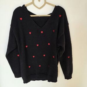 Black Sweater with Red Heart Accents
